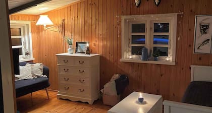 A cozy older summerhouse on a small island