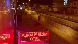 A nighttime street view with a red-lit staircase leading to a building labeled 'ASKALE BİZMİ OTEL'. - AŞKALE BİZİM OTEL (Askale)