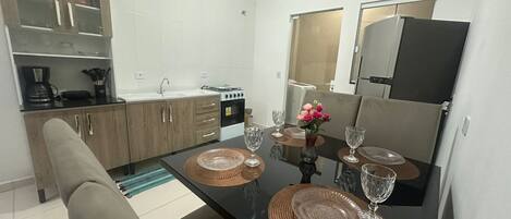 Fridge, stovetop, coffee/tea maker, cookware/dishes/utensils