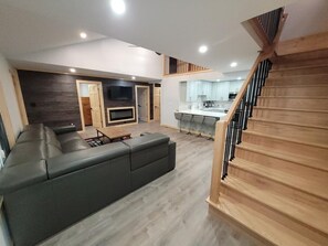 Smart TV, fireplace, table football, books