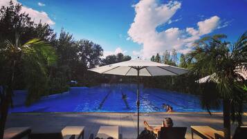 Seasonal outdoor pool, pool umbrellas, pool loungers
