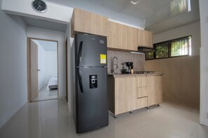 Fridge, microwave, stovetop, coffee/tea maker