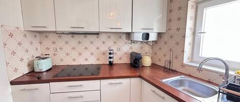 Fridge, oven, coffee/tea maker, toaster