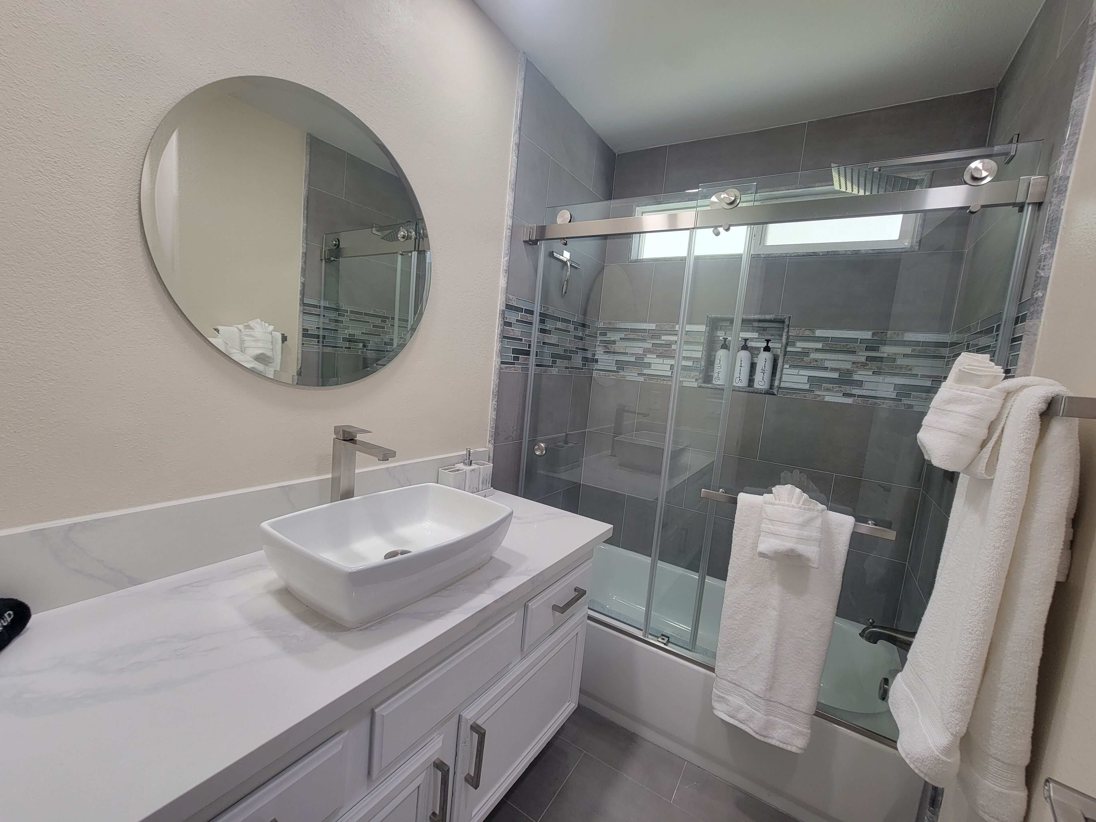 Shower, hair dryer, towels, soap