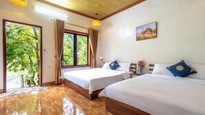 A room with two beds, wooden flooring, a large window with curtains, and a painting on the wall. - Tràng An Sunny River Homestay (Ninh Binh)