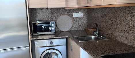 Fridge, microwave, oven, cookware/dishes/utensils