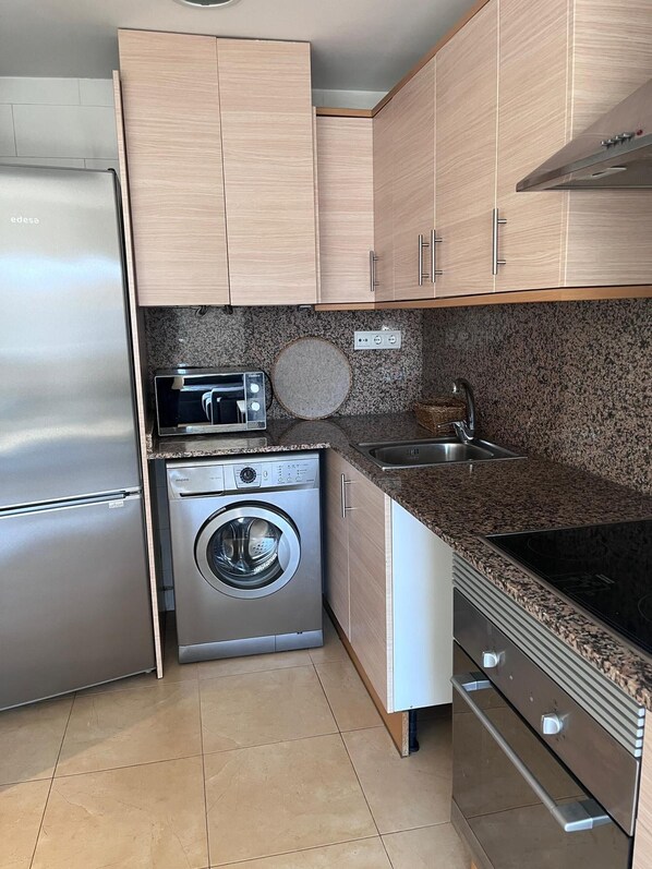 Fridge, microwave, oven, cookware/dishes/utensils