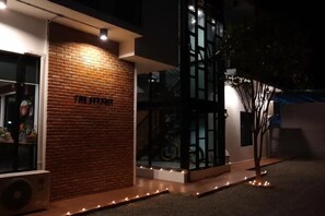 A building with a brick facade and a sign that reads 'THE HOUSE'. - The Connect Chiang Mai (Chiang Mai)