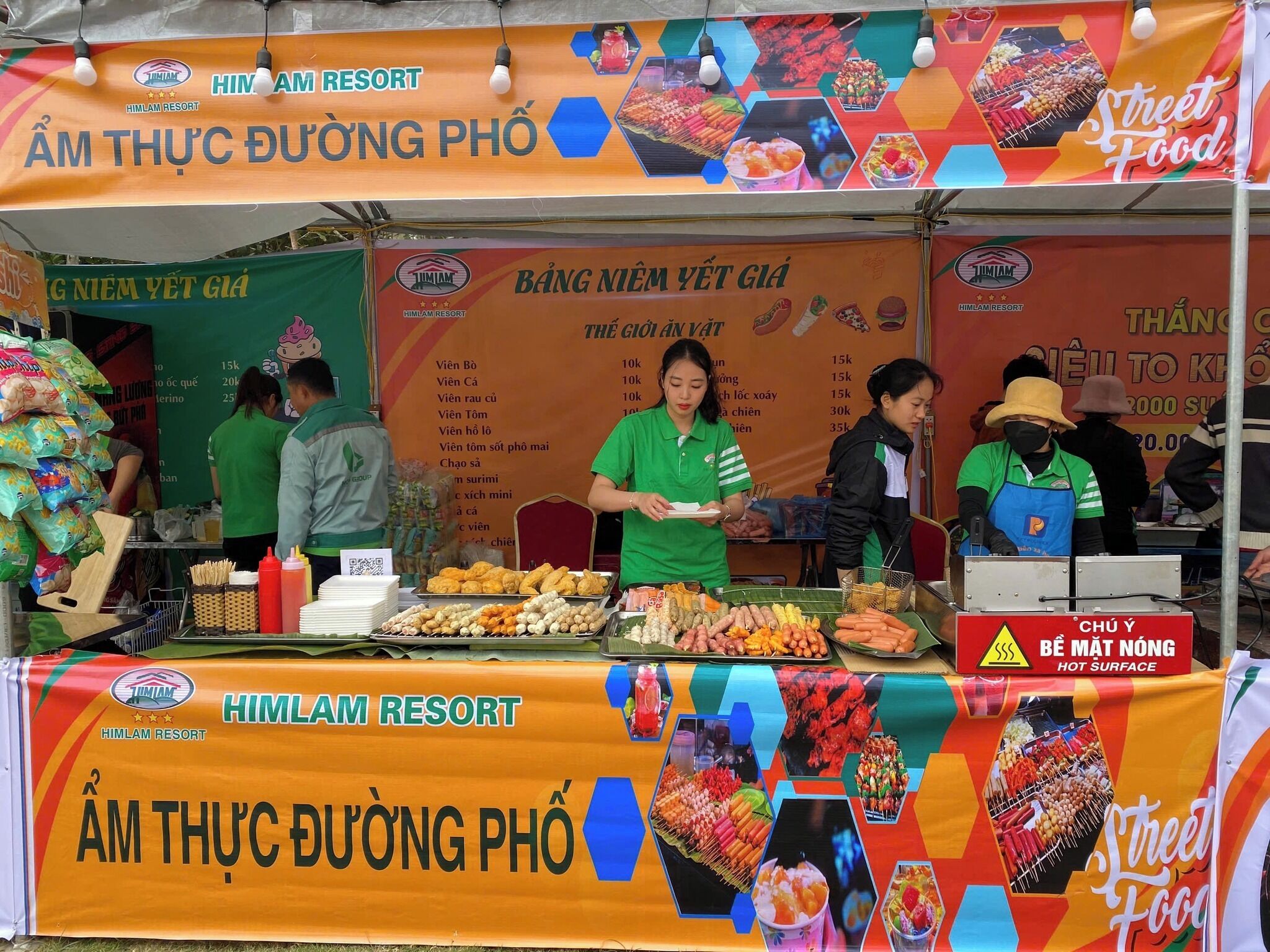 A street food stall at HIMALAM RESORT with various food items displayed.
