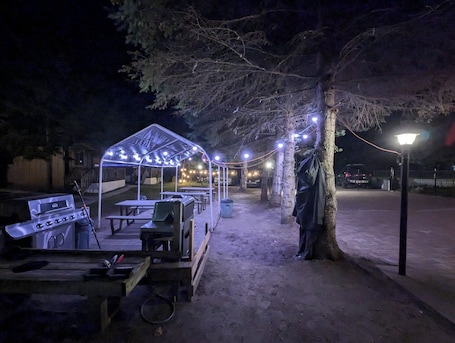 Outdoor dining. Traditional Tiny Wood Cottage #22 Camping style Cottages 5 minutes to the beach!