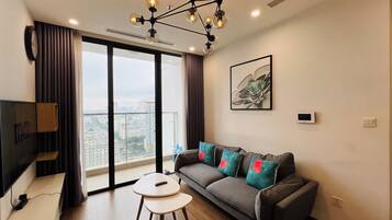 Apartemen Deluks, 2 kamar tidur, AC, pemandangan kota | Area keluarga | TV layar datar