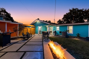 A residential property with a covered patio, outdoor seating, and a fire feature. - Newly Remodeled 3 Bed/2 Bath, Hot Tub, Pet Friendly, Corpus Christi (Corpus Christi)