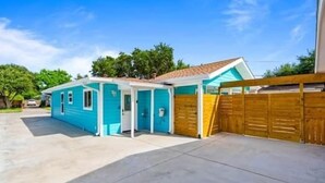 A single-story house with a garage, a front door, and a driveway.