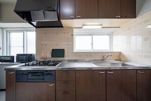 Full-size fridge, microwave, stovetop, toaster