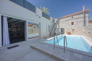 Seasonal outdoor pool, a heated pool