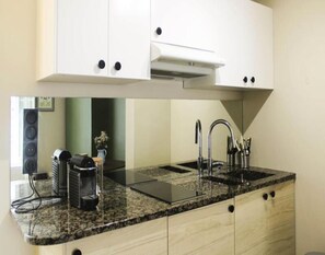 Fridge, coffee/tea maker, cookware/dishes/utensils