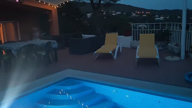 A pool area with a tiered design, outdoor seating, and string lights. - Vila with private pool, sea view 7km away Pets welcome (Calonge)
