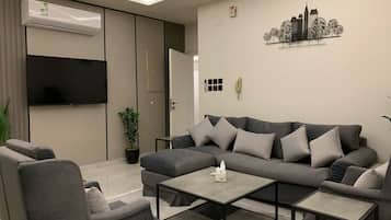 Luxury Penthouse 105 | Living area | 70-inch flat-screen TV with satellite channels, Netflix