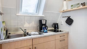 Fridge, stovetop, coffee/tea maker, electric kettle