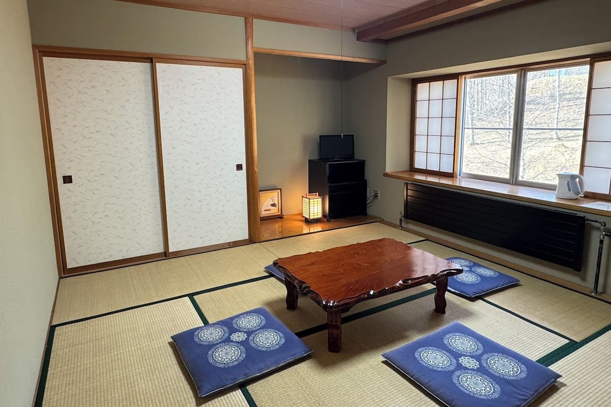 Classic Quadruple Room, Mountain View | Desk, laptop workspace, blackout curtains, iron/ironing board