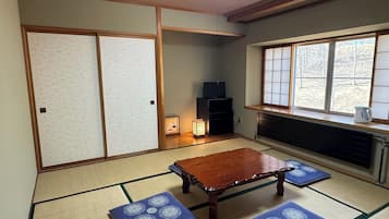Desk, laptop workspace, blackout curtains, iron/ironing board