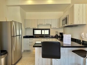Fridge, microwave, stovetop, coffee/tea maker
