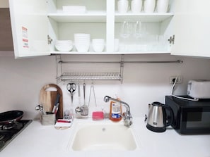 Fridge, electric kettle, toaster, cookware/dishes/utensils