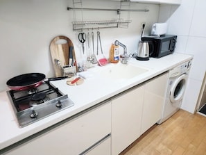 Fridge, electric kettle, toaster, cookware/dishes/utensils