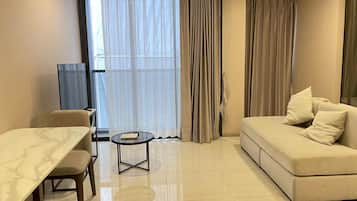 Classic Apartment, Balcony, City View | Living area | 40-inch LCD TV with cable channels