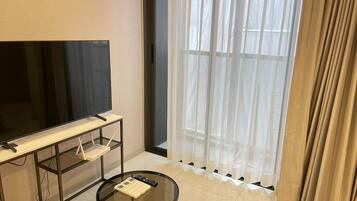 Classic Apartment, Balcony, City View | Living area | 40-inch LCD TV with cable channels