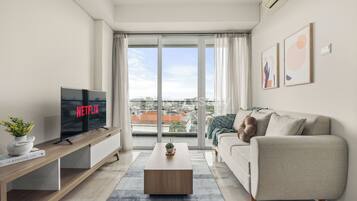 Apartment, 3 Bedrooms, City View | Living area | 43-inch Smart TV with cable channels, Netflix, streaming services
