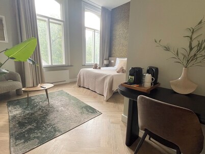 Unwind in this refined suite, blending modern comfort with historic charm.