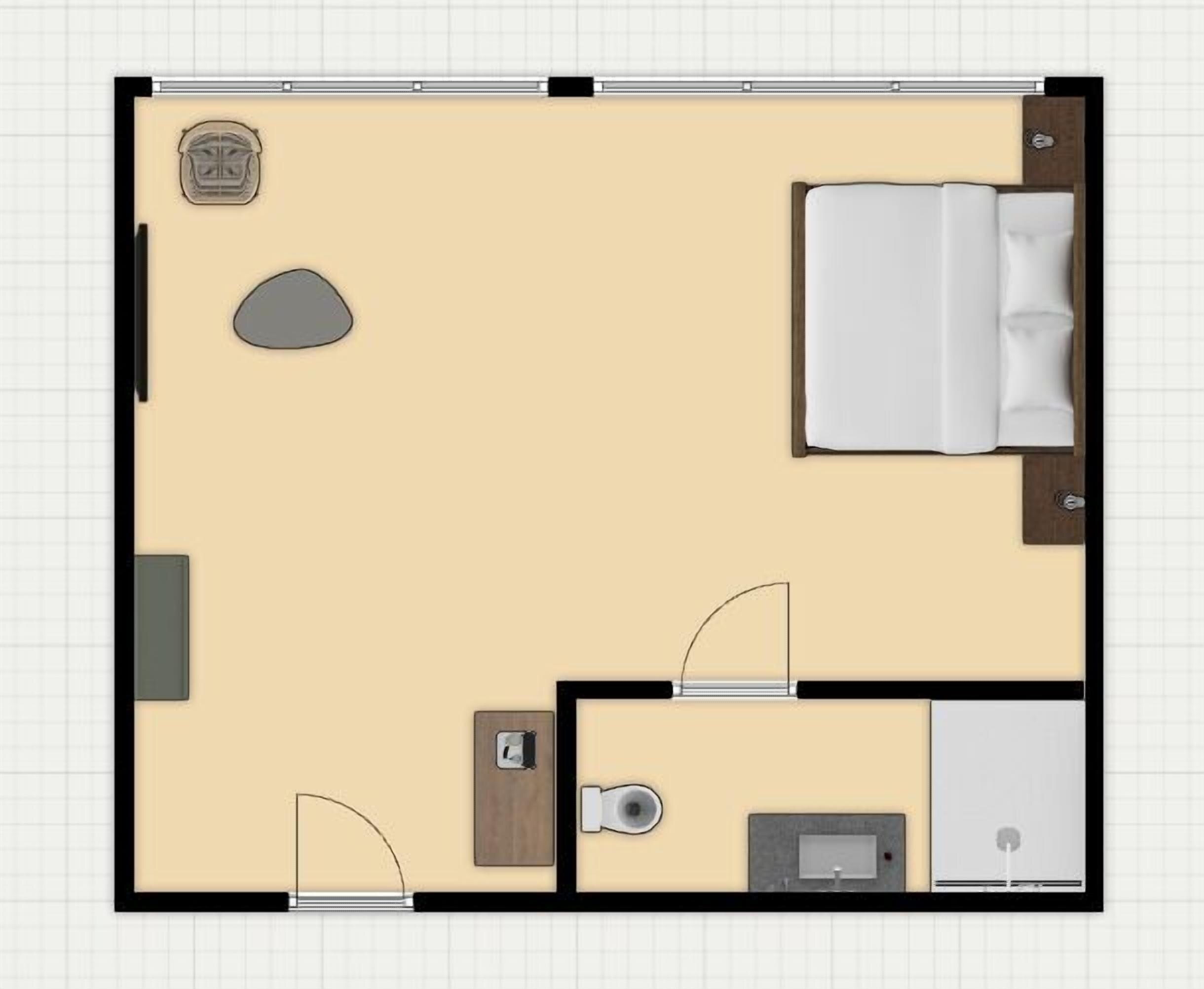 A hotel room layout with a bed, a small desk, a toilet, and a shower area.