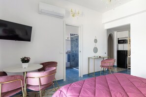 Iron/ironing board, travel crib, free WiFi, bed sheets