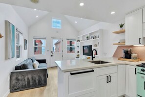 Fridge, microwave, oven, stovetop - Modern Beachfront Cottage (Oceanside)