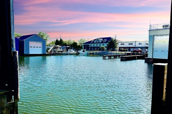 Peaceful Harbor at Sunset
End your day with a breathtaking view of boats and waterfront homes, all under a colorful Lake Erie sunset sky.