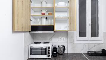 Apartamento, 1 quarto, cozinha, vista para a cidade | Cozinha privada | Frigobar, fogão, cooktop, máquina de café expresso