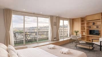 Deluxe Studio, City View | Living area | 72-cm flat-screen TV with digital channels