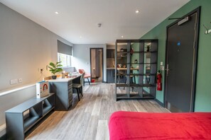 A modern room with a desk, chair, bookshelf, and a bed. - Sherbourne Student Village (Coventry)