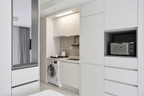 Fridge, microwave, stovetop, cookware/dishes/utensils