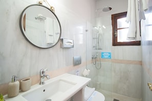 Shower, hair dryer, slippers, towels