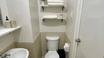 Shower, towels, soap, toilet paper