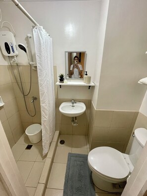 Shower, towels, soap, toilet paper