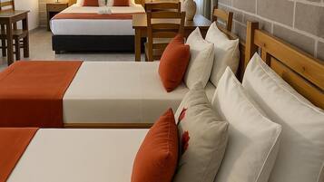 Family Quadruple Room | Minibar, laptop workspace, iron/ironing board, free WiFi