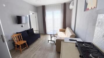 Family Triple Room, Sea View | Minibar, free WiFi, bed sheets