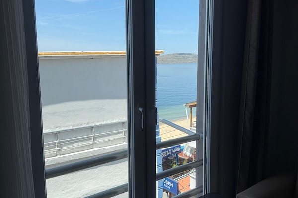 Family Triple Room, Sea View | Minibar, free WiFi, bed sheets