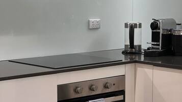 Coffee/tea maker, fridge, microwave, oven
