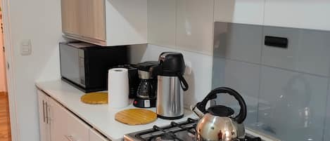 Microwave, oven, coffee/tea maker, cookware/dishes/utensils