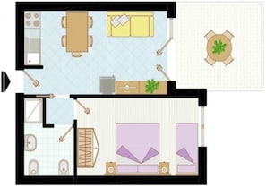 Ein Hotelzimmer mit Bett, Nachttisch, Kleiderschrank und einem kleinen Badezimmer.