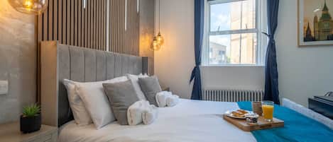 Deluxe Studio Suite, 1 Queen Bed, City View | Desk, laptop workspace, iron/ironing board, free WiFi